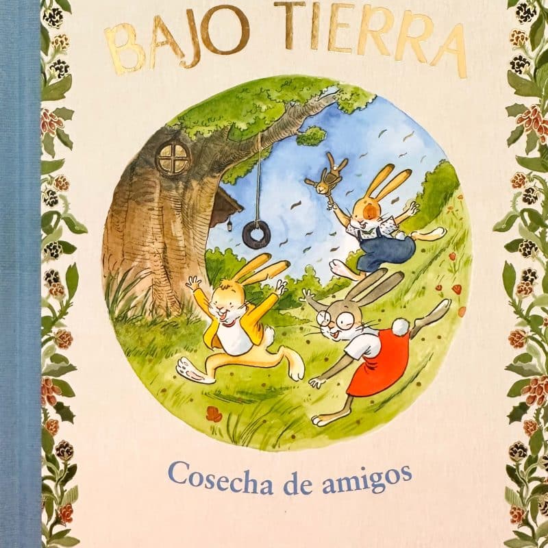 Portada del libro en la que aparece la ilustración de tres liebres jugando en el campo